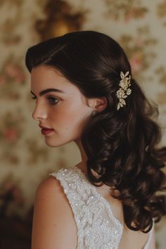 a woman in a wedding dress wearing a hair comb