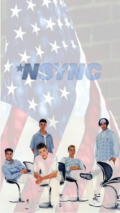 a group of men sitting on top of chairs in front of an american flag background