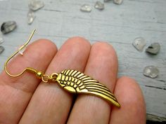 One gold angel wing earring, Symbolic dangle, Accessory for men, Men wing dangle, Punk earring, Boys earring, Wing, Large dangle, Unisex earring. One earring size is 2 Inches (50 mm) NOTE: Delivery time to Europe is 7 to 14 working days. Delivery time to U.S. or the rest of the world - 14-30 working days. Pierced Winged Earrings As Gift, Winged Jewelry With Ear Wire For Gifts, Handmade Gold Wing-shaped Earrings, Boys Earring, Gold Angel Wings, Punk Earrings, Gold Wing, Unisex Earrings, Gold Angel