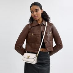 Our structured Cassie crossbody has classic good looks and ample room to hold everyday essentials with three organized compartments. A more compact version of the original the 17 is crafted of refined pebble leather and finished with our iconic turnlock closure. Style the versatile bag three ways: carry by hand with the ladylike top handle wear on the shoulder with the elegant chain strap or crossbody with the adjustable leather strap. | Coach Cassie Crossbody Bag 17 - Women's Designer Crossbody Coach Top Handle Bag, Classic Shoulder Bag With Cc Turnlock And Double Flap, Classic Double Flap Shoulder Bag With Cc Turnlock Closure, Elegant Flap Bag With Cc Turnlock For Everyday Use, Elegant Flap Bag With Cc Turnlock Closure, Classic Flap Bag With Cc Turnlock Closure, Modern Satchel Shoulder Bag With Cc Turnlock Closure, Chic Satchel With Cc Turnlock Closure For Everyday Use, Timeless Shoulder Bag With Cc Turnlock Closure For Travel