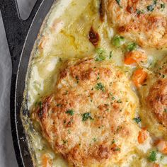 some meat patties are cooking in a skillet