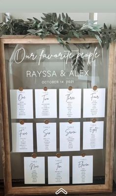 a wooden frame with seating cards attached to it