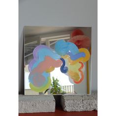 an image of a mirror that has some balloons in it