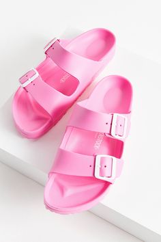 Birkenstock Arizona EVA Sandal | Urban Outfitters Comfortable Beach Clogs With Arch Support, Spring Beach Clogs With Arch Support, Summer Flat Clogs With Buckle Closure, Summer Beach Clogs With Arch Support, Pink Beach Clogs For Summer, Pink Summer Beach Clogs, Summer Flat Clogs With Branded Insole, Pink Summer Clogs With Cushioned Footbed, Summer Pink Clogs With Cushioned Footbed