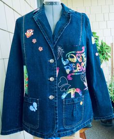 Ladies large denim jacket. Shoulder to shoulder is 17 inches. Sleeve length from Shoulder is 25 inches. Jacket length 28 inches. The waist 41 to 45 inches. Hip to fit up to 50 inches. 2 pockets, three button jacket.  Tags: Panda Bear, Love and Peace sign, Butterflies and flowers, Owl and much more Dark Wash Cotton Blazer With Pockets, Denim Blue Long Sleeve Blazer With Pockets, Denim Blue Blazer With Pockets, Casual Denim Blazer With Patch Pockets, Casual Denim Blue Blazer With Pockets, Button-up Denim Blue Blazer With Pockets, Denim Blue Button-up Blazer With Pockets, Dark Wash Button-up Blazer With Pockets, Denim Blue Blazer With Patch Pockets