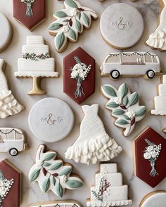 decorated cookies are arranged on a table