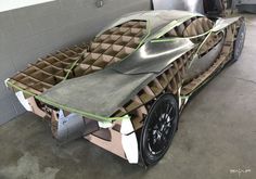 the car is made out of cardboard and has been wrapped in duct tape to protect it from damage