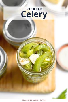 pickled celery in a mason jar on a cutting board with the text pickled celery