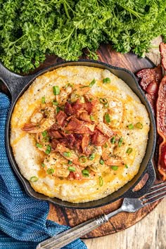 a cast iron skillet filled with mashed potatoes and bacon