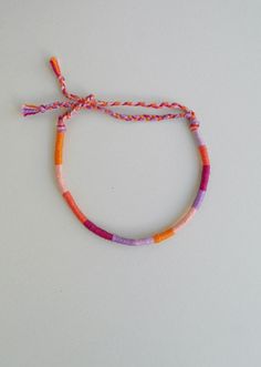 This wrapped bracelet is made out of 6 different colours of cotton thread It has a tie knot closure and is ended with two braids in order to fit a lot of sizes. Thickness: 0,4cm Similar wrapped bracelets in my shop: https://www.etsy.com/listing/462500661/pastel-friendship-braceletcotton?ref=listing-shop-header-0 More friendship bracelets in my shop: https://www.etsy.com/shop/LuckyRatJewellery?section_id=16489590&ref=shopsection_leftnav_7 *Colors may differ slightly from the original due to t Funky Bracelets, Thread Wrapped Bracelets, Bijoux Piercing Septum, Bracelet Cotton, Simpul Makrame, String Bracelet Patterns, Yarn Bracelets, Cute Friendship Bracelets, Wrist Stacks