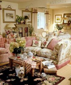 a living room filled with furniture and flowers