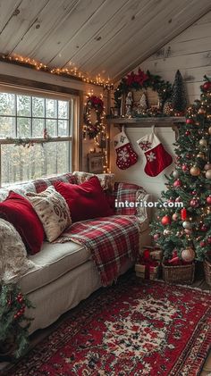 a living room decorated for christmas with red and white decorations