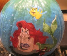 the little mermaid pumpkin has been painted on