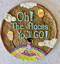 a cookie with the words oh the places you'll go written on it