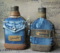 two blue bottles with tags on them sitting next to each other