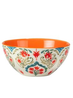 an orange and blue bowl with floral designs on the rim, sitting on a white surface