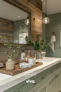 a bathroom with green cabinets and white counter tops is featured in this ad for viva