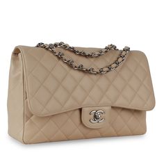 Under the creative direction of Karl Lagerfeld, Chanel continues with its line of classic quilted bags. This enviable Single Flap Bag is crafted in caviar leather, and detailed with fine stitching and silver hardware. The chain is interwoven with leather and can be  on either a single shoulder strap or doubled up. The neutral colour means this bag fits seamlessly into any wardrobe, and it can stay in there forever! The Classic Flap from Chanel is a true investment piece. SPL Exterior:  Quilted c Beige Chanel Bag, Lagerfeld Chanel, Quilted Bags, Western Purses, Classic Flap Bag, Unique Purses, Travel Handbags, Side Bags, Creative Direction