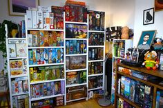 a room filled with lots of books and stuffed animals on top of shelves next to each other