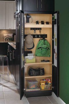 an open refrigerator in a kitchen next to a counter top with some items on it