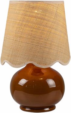 a brown table lamp with a beige shade on the top and bottom part of it