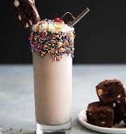 a chocolate milkshake with sprinkles and an ice cream sundae