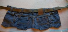 a pair of blue jean shorts with a brown belt attached to the bottom of it