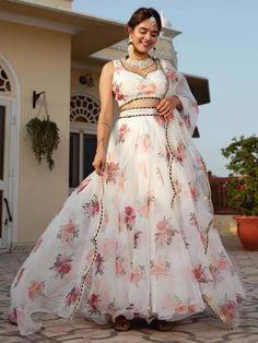 Introducing our exquisite magnetic white floral printed organza festival wear lehenga choli, a stunning ethnic ensemble that combines traditional elegance with a touch of modern flair. This captivating lehenga choli is perfect for festivals, events, and any special occasion where you want to make a statement.
Crafted from high-quality white color organza tebi material, this lehenga features intricate floral printed work that adds a touch of femininity and grace. The white choli is embellished wi Floral Organza Lehenga, Organza Anarkali, Organza Frocks, Floral Organza Dress, Lehenga Choli For Women, Choli For Women, Printed Organza, Indian Lehenga Choli, Organza Lehenga