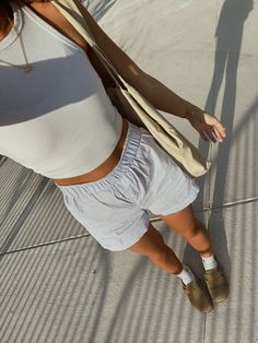 striped pants outfit, linen pants, linen shorts, striped shorts, summer outfit, costal outfits, coffee pictures, ootd, outfit ideas, women’s outfits, elevated casual outfits, blue pinstripe shorts, poses with bag, clogs, instagram picture ideas, boxer shorts, clog outfit ideas Pinstripe Shorts Outfit, Striped Linen Shorts Outfit, Blue Striped Shorts Outfit, Pinstripe Shorts For Summer, Linen Shorts Outfits Women, Fitted Striped Summer Shorts, Pinstripe Shorts, Striped Boxer Shorts Outfit, Striped Lounge Shorts