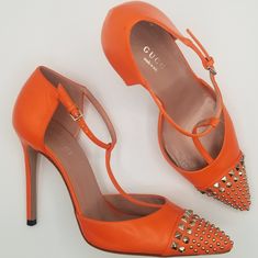 Gorgeous Orange Leather Studded Stiletto Heel Pointed Toe With Box, Extra Heel Tips, And Dustbag From Gucci's Salon Collectoim Silver Colored Studs T-Strap Design For Comfort 370801 Perfect For Designer, Luxury, Bright, Punk, Classic, Timeless, Moto, Summer, Fall, Winter, Spring, Gucci Orange, Strap Pumps, Orange Leather, Strap Design, Vibrant Orange, Gucci Shoes, T Strap, Stiletto Heel, Summer Fall