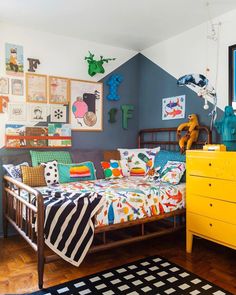 a child's bedroom decorated in bright colors