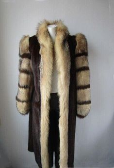 Item Description: Superbly soft and natural dark pastel mink fur coat with fox fur collar and trims. Full top quality Canadian mink fur pelts, warm and plush crystal fox fur collar in a tuxedo style and inserts on sleeves, front furrier closures, side slit pockets and satin lining complete the look of this beautiful fur coat. Fur and lining in mint condition. Cleaned and glazed. SIZE: 8 Chest closed edge to edge 42" SLEEVES: 31" Adjustments Free of Charge! LENGTH: 51" SUGGESTED RETAIL VALUE: $4200 Dark Pastel, Coat Fur, Tuxedo Style, Mink Fur Coat, Fur Coats, Early Fall, Mink Fur, Fox Fur, Fur Collar