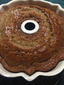 a bundt cake in a white pan on a table