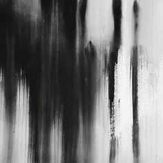 an abstract black and white painting with brush strokes