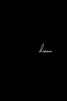 the word dream written in cursive writing on a black background