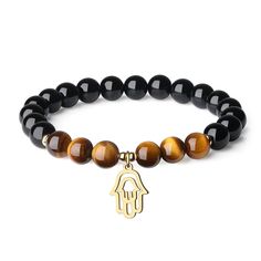 PRICES MAY VARY. Material: 8mm Black Tourmaline, Brown Tiger Eye; Stainless steel hamsa hand charm Inside circumference of this stone bracelet is 6.5"(16.5cm) This black tourmaline bracelet decorates with a cute hamsa hand charm, could be used as a protection amulet since hamsa hand represents blessings, power and strength Gems Meaning: Black tourmaline is said to protect you from dark art and ward away jealousy, evil, anger, hatred and negative feelings and bring about peace and harmony A beaut Gem Meaning, Elemento Terra, Chakra Raiz, Black Tourmaline Bracelet, Black Tourmaline Stone, Brown Tiger, Hamsa Jewelry, Brown Tiger Eye, Protection Amulet