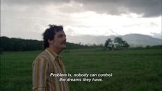 a man standing in the middle of a field with a quote on it that reads, problem is nobody can control the dreams they have