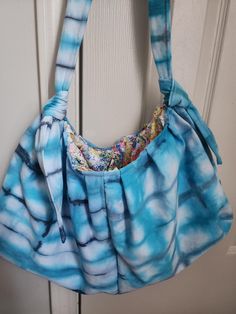 This beauty is hand dyed on the outside with a splash of color inside! Perfect to hold all your everyday things.  The bag is 15 inches wide and 10 inches tall, 26 inches tall with straps Everyday Hand Dyed Cotton Bags, Daily Use Tie-dye Tote Bag, Casual Blue Bags With Rolled Handles, Everyday Hand Dyed Tote Bag, Hand Dyed Rectangular Bags For Daily Use, Everyday Hand-dyed Tote Bag, Tie Dye Rectangular Bag For Everyday Use, Rectangular Tie Dye Bag For Everyday Use, Rectangular Tie-dye Bag For Daily Use