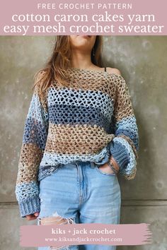 a woman standing in front of a wall wearing a crochet sweater and jeans