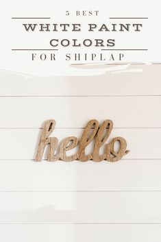 white paint colors for shiplap with the words hello and hello painted on it