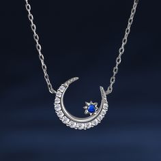 The crescent moon symbolises new beginnings and the ever-changing cycles of life. Crafted in sterling silver, this necklace features a delicate crescent moon and a twinkling blue star. This piece embodies the celestial beauty and the mystical allure of the night sky. Wearing this necklace is like carrying a piece of the night sky close to your heart. It serves as a reminder of the beauty and vastness of the universe, igniting a sense of wonder and inspiration within you.Carat Weight: 0.659 ctSto Cycles Of Life, Moon Star, Necklace Online, Blue Star, Sterling Silver Necklace, Crescent Moon, Stars And Moon, New Beginnings, Night Sky