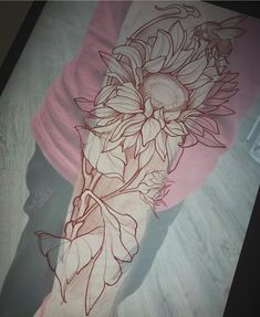 a drawing of sunflowers on a pink shirt