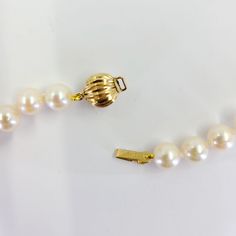 This necklace features 6.5-7mm cultured pearls and measures 30 inches long with a 14 Karat yellow gold ball clasp. Classic Single Strand Pearl Necklace With Round Beads, Timeless Gold Pearl Necklace With Round Beads, Classic Gold Single Strand Pearl Necklace, Elegant Necklace With Gold Clasp, Elegant Round Necklace With Gold Clasp, Classic Gold Pearl Necklace, Classic Yellow Gold Pearl Necklace, Gold Pearl Necklace For Formal Occasions, Classic Gold Pearl Necklace For Formal Occasions