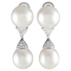 These Cartier earrings are ideal for even your most special occasions. The stunning 14mm Pearls are expertly accented by triangular Diamonds with a total weight of 2.05 carats and additional Diamond accents totaling 0.35 carats. Crafted from shimmering Platinum, each one measures 1.65 long by 0.50 wide.This jewelry piece is offered in estate condition and include the manufacturer's box. Luxury Pear-shaped Earrings For Formal Occasions, Luxury Pear-shaped Earrings For Formal Events, Luxury White Clip-on Diamond Earrings, Gia Certified Luxury Diamond Earrings For Formal Occasions, Luxury Pear-shaped Diamond White Diamond Earrings, Luxury Pear-shaped Diamond White Earrings, Formal White Gold Clip-on Diamond Earrings, White Gold Clip-on Diamond Earrings For Formal Events, Luxury White Brilliant Cut Bridal Earrings