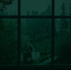 an open window with a view of a house in the distance and trees outside it