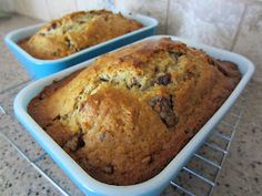 two loafs of banana bread cooling on a rack