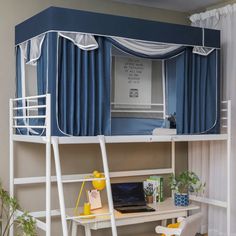 a bunk bed with a desk underneath it and curtains on the top, along with a ladder