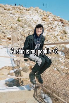 a man sitting on top of stairs with the caption,'austin is my pookiie 3 '