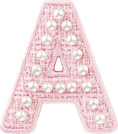 a pink letter with pearls on it