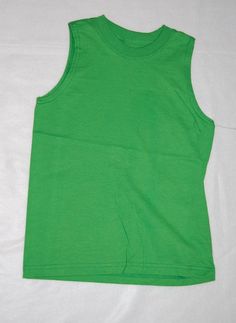 USA Standard Size: Boy's Extra Small 4-5 Brand: Fruit of the Loom Boys sleeveless muscle tee shirt. Bright green, solid color. Material: 100% cotton One standard photo used to represent all sizes and may not match the size indicated in this listing. Plain Green Top For Summer, Casual Green Sleeveless Top, Casual Green Sleeveless T-shirt, Green Casual Muscle Tee, Basic Green Tank Top, Green Short Sleeve Plain Top, Basic Green Plain Top, Plain Cotton Sleeveless Tank Top, Green Muscle Tee For Summer